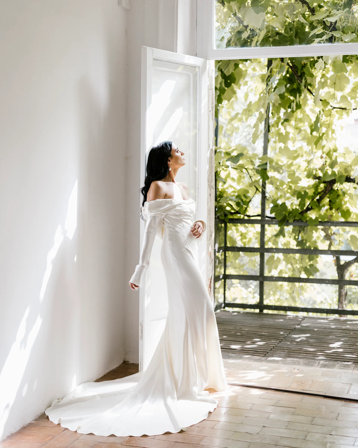 The bride by an open window, looking out