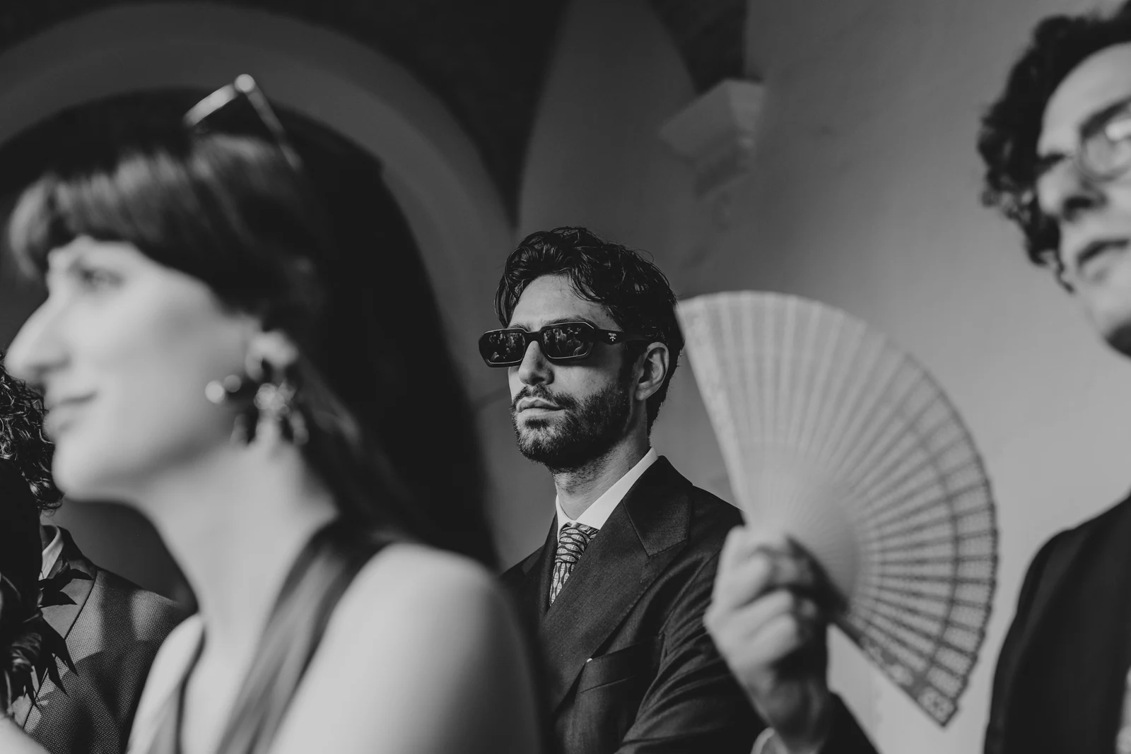 A woman and a man with a fan following the ceremony