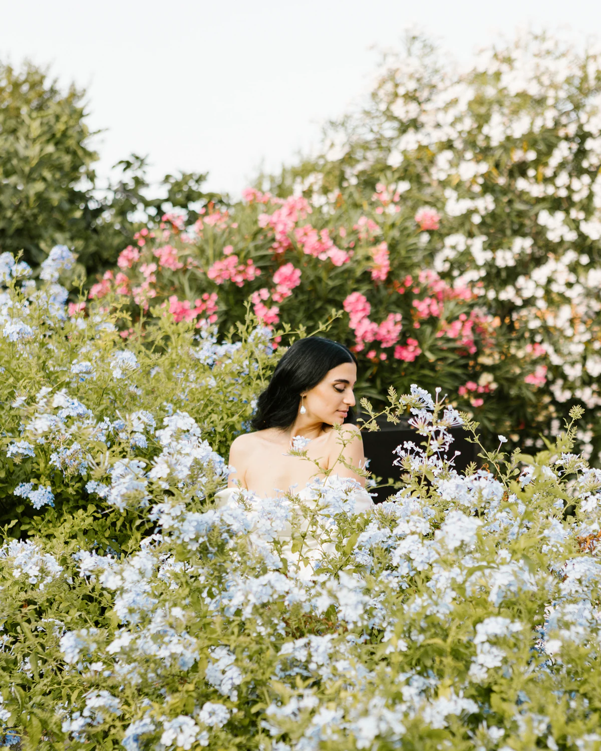 The bride among flowering shrubs
