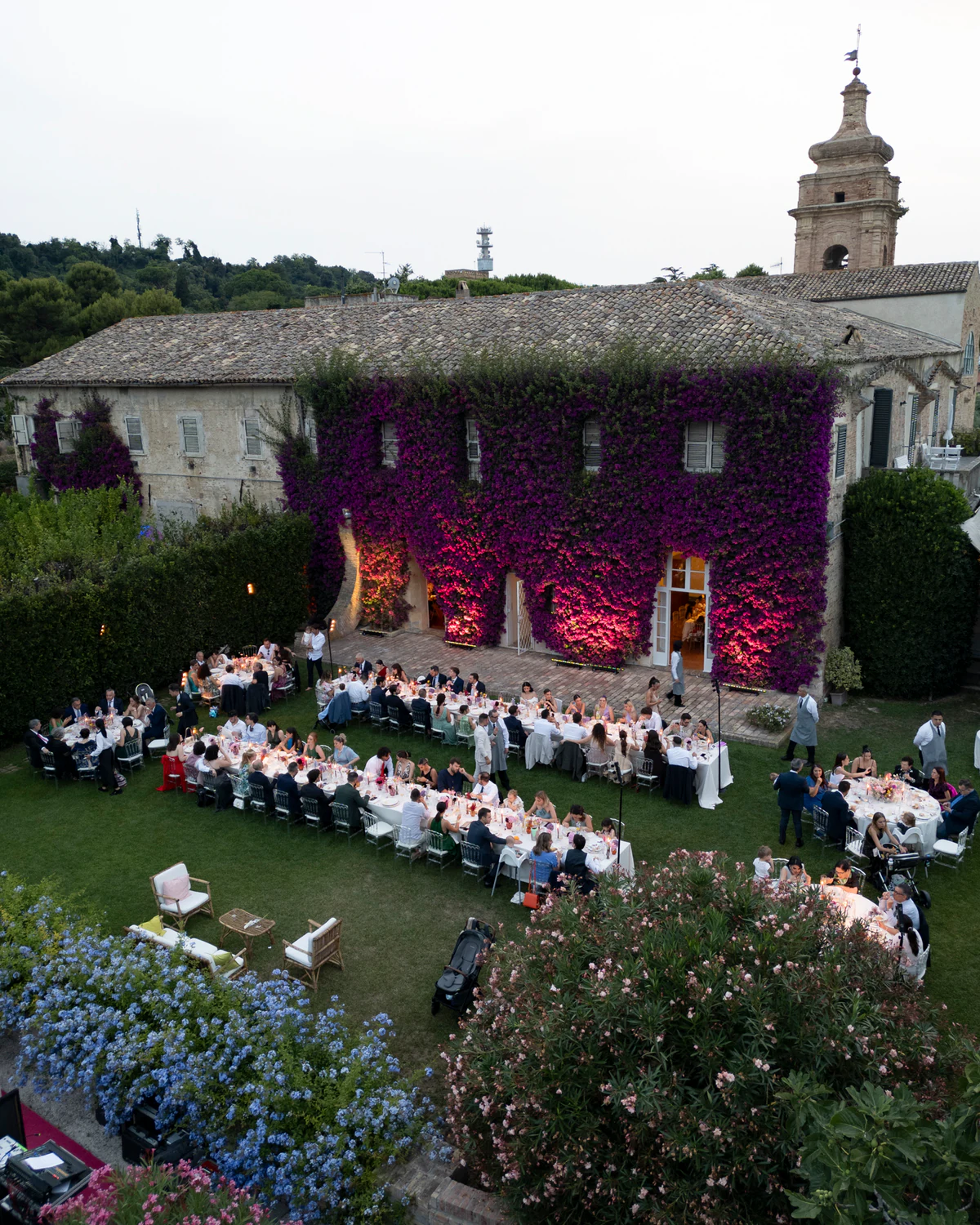 The dinner in the garden seen from above, with the bell tower behind