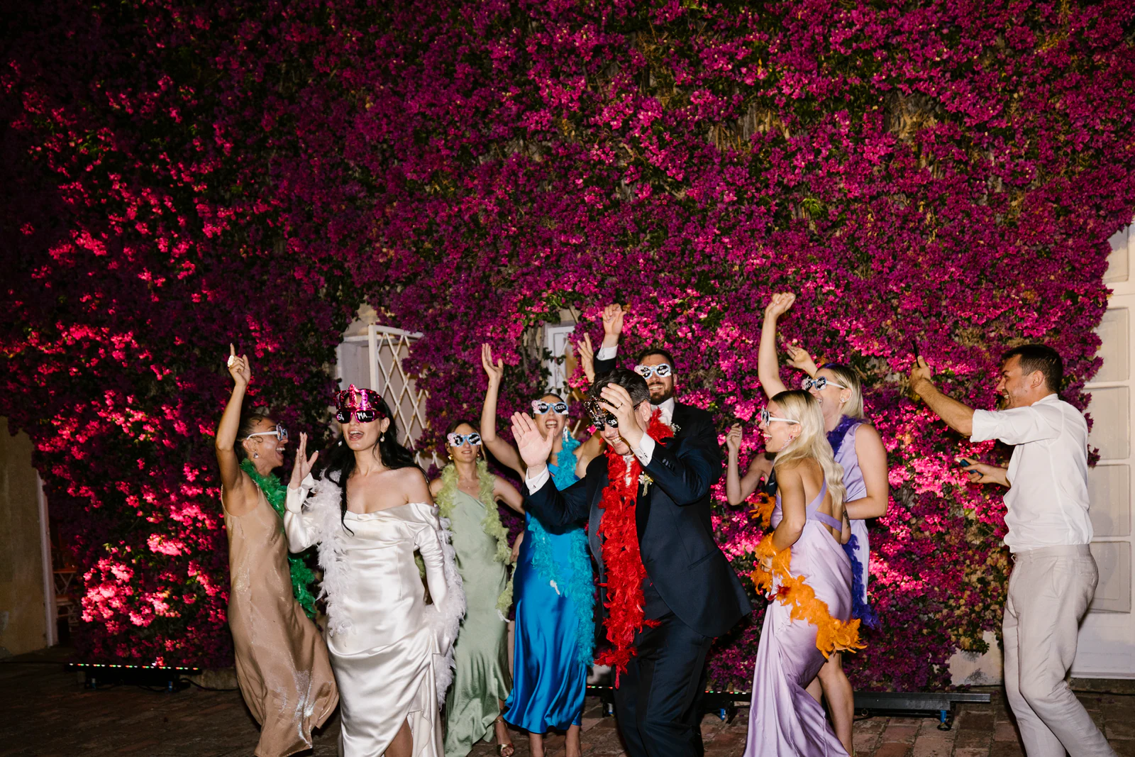 Dancing under the bougainvillea, lit in pink at night