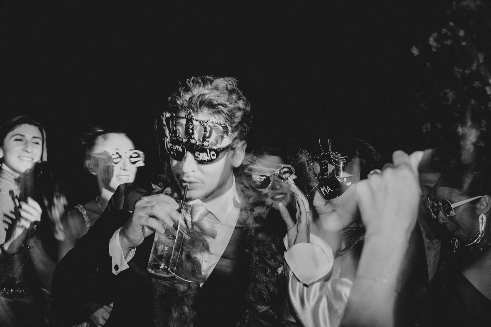 Guests in masks at the party