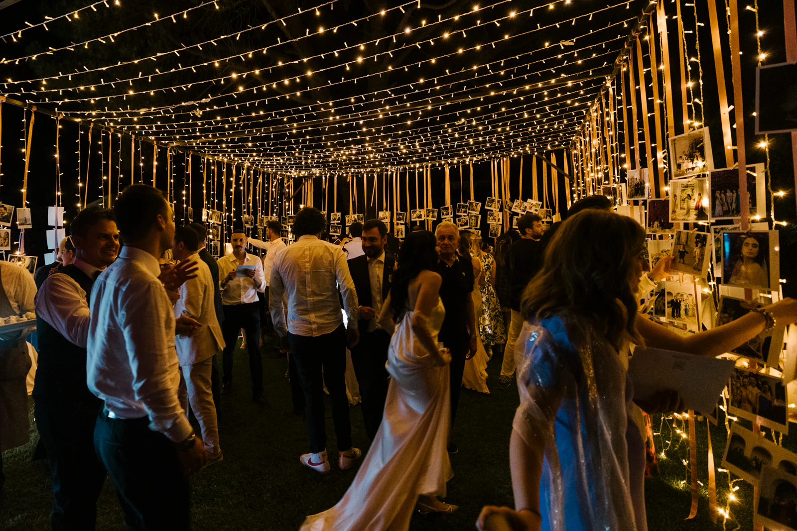 The party under a canopy of string lights
