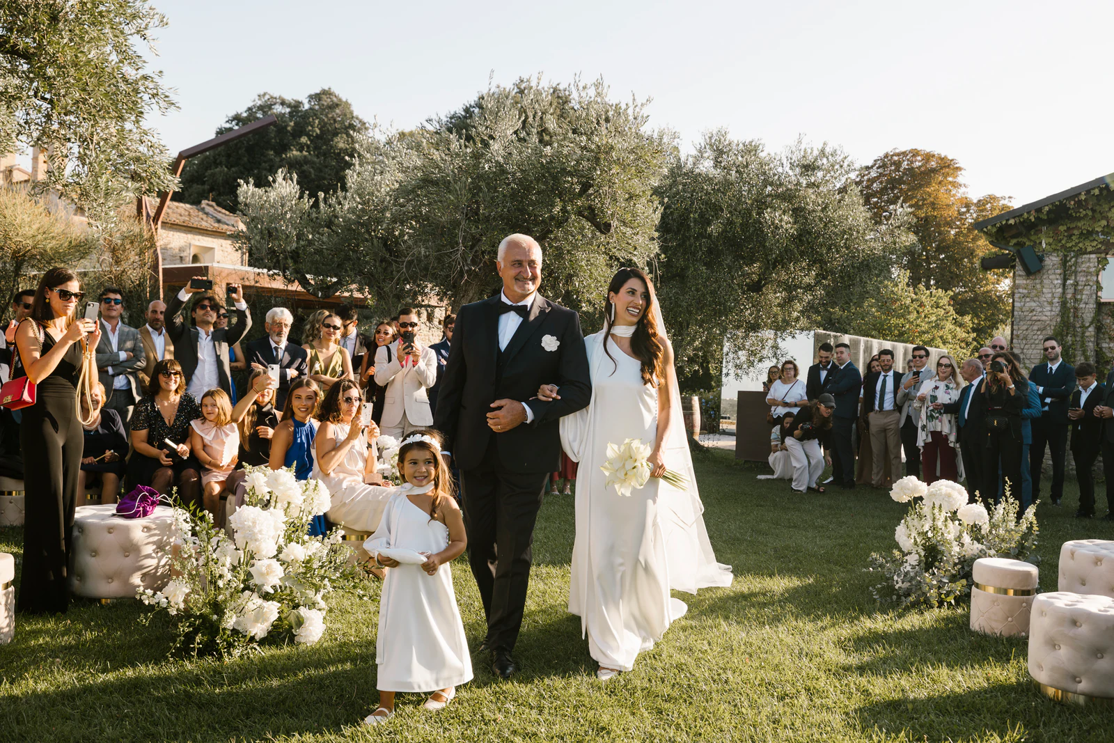 The bride walking down the aisle on her father's arm