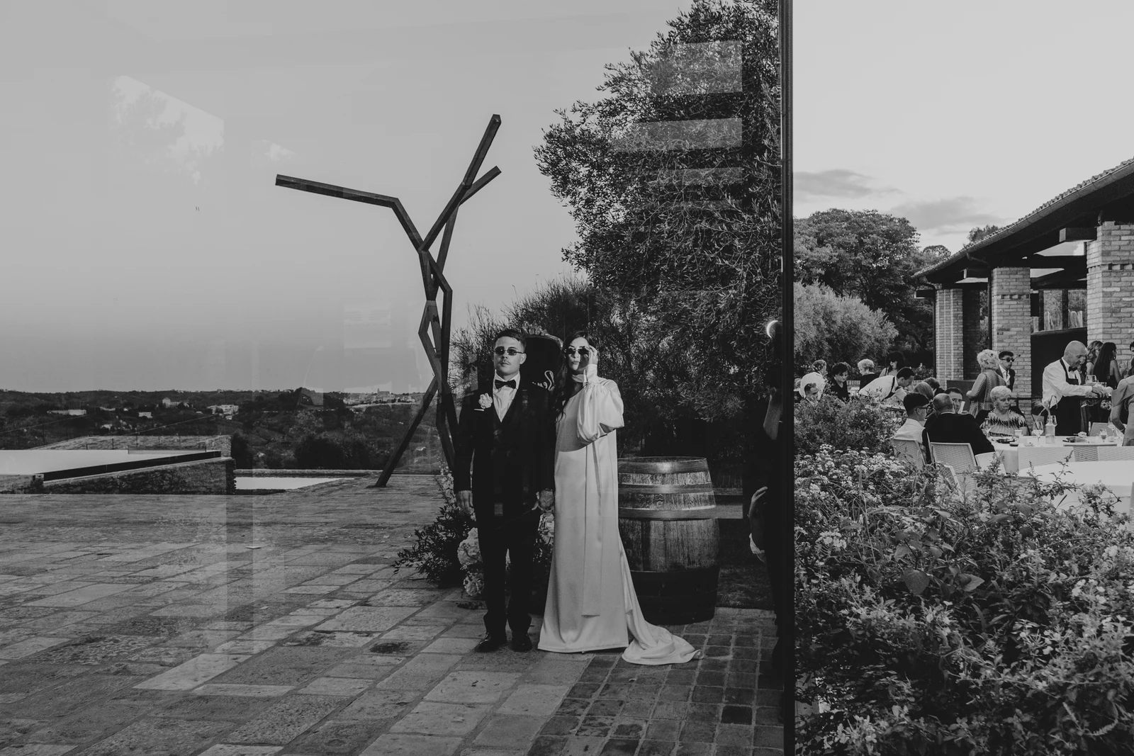 The couple on the terrace, reflected in the glass