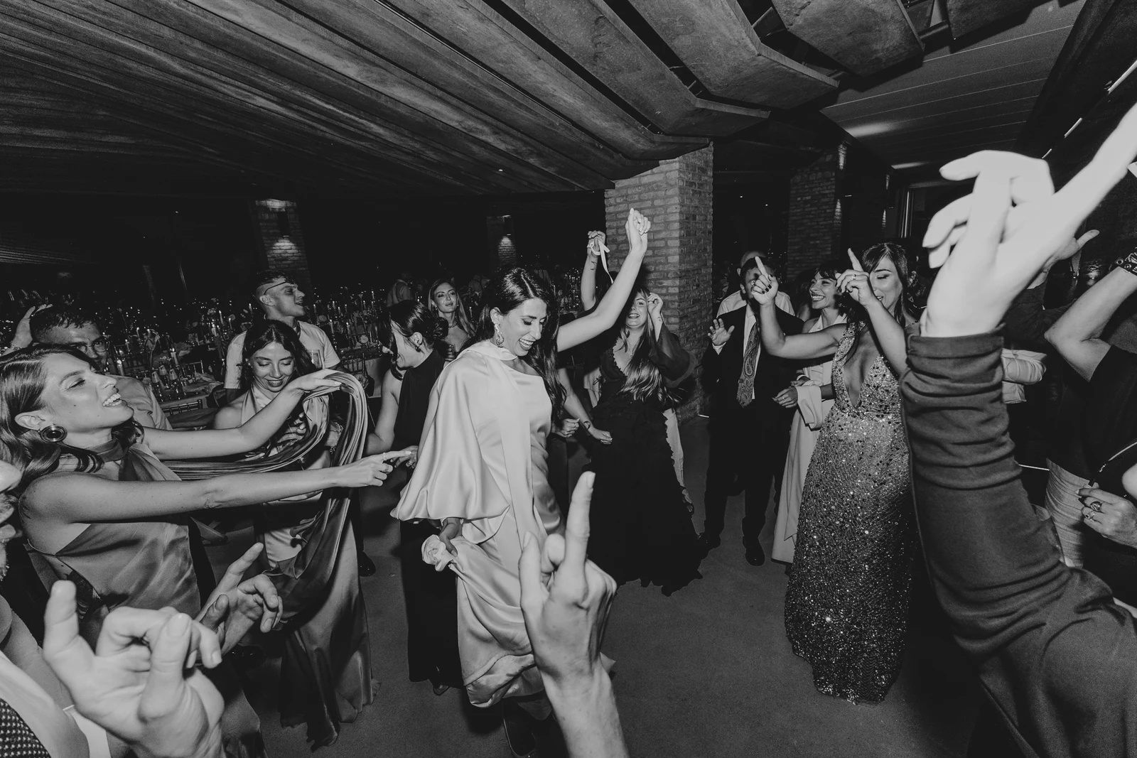 Guests dancing with their arms in the air