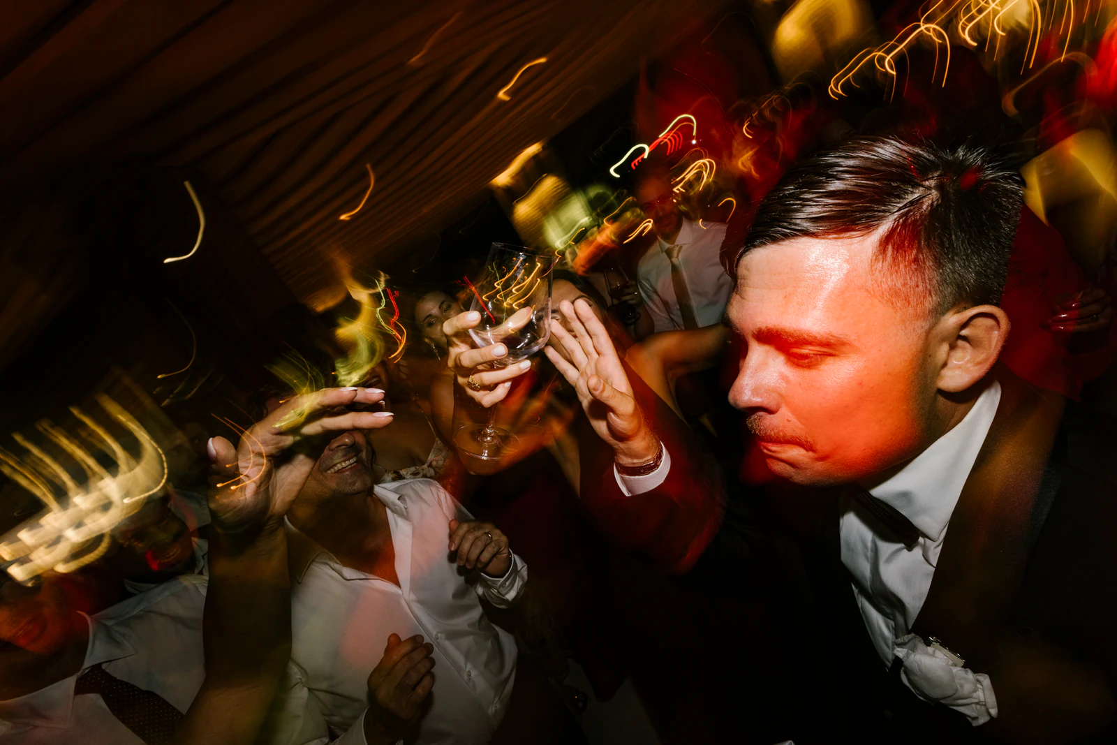 The groom singing with his friends at night