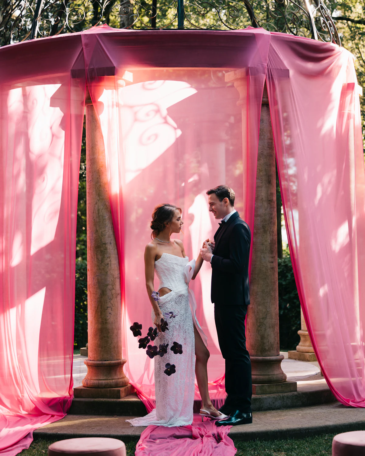 The couple under the pink gazebo