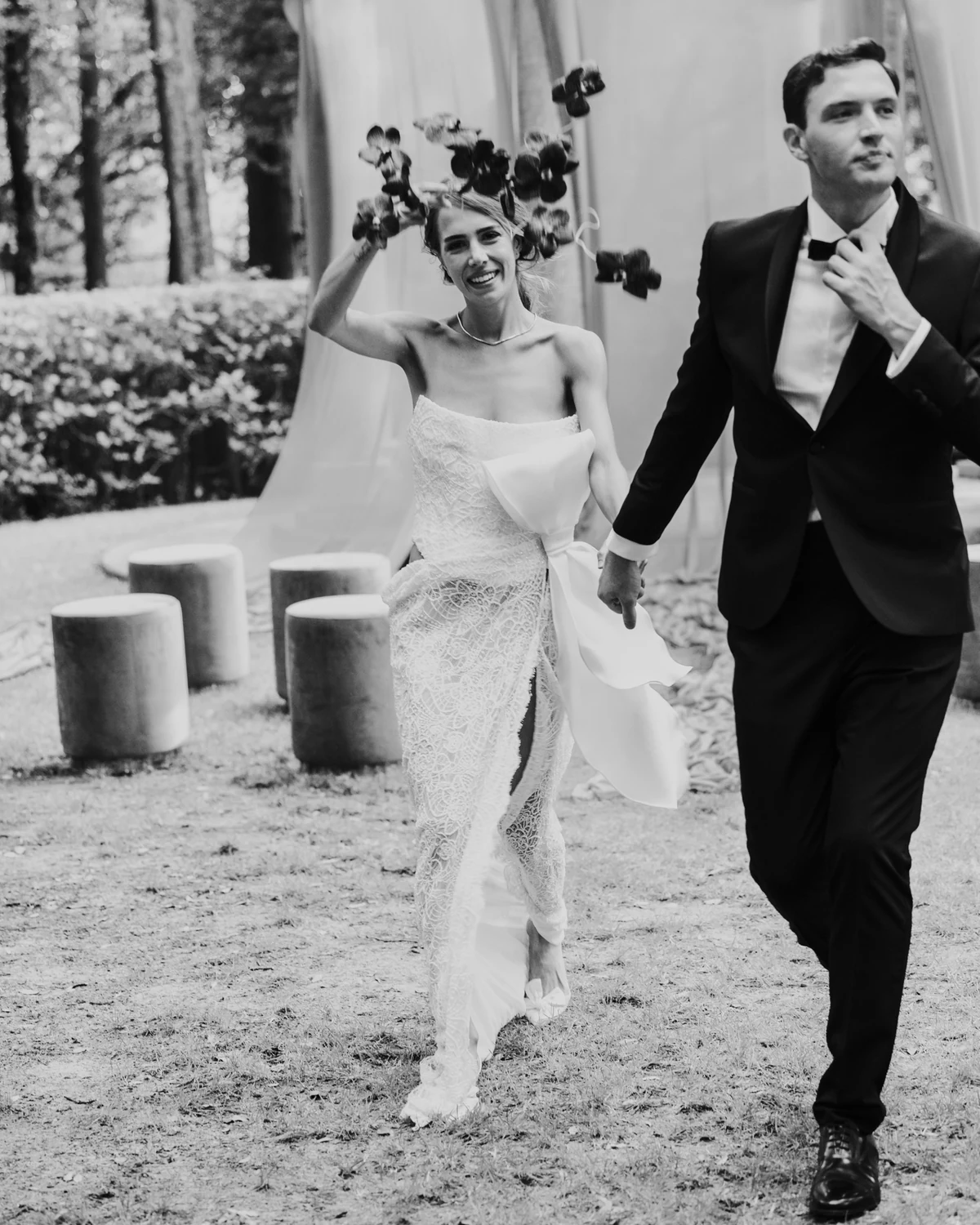 The couple walking in the garden among the stools