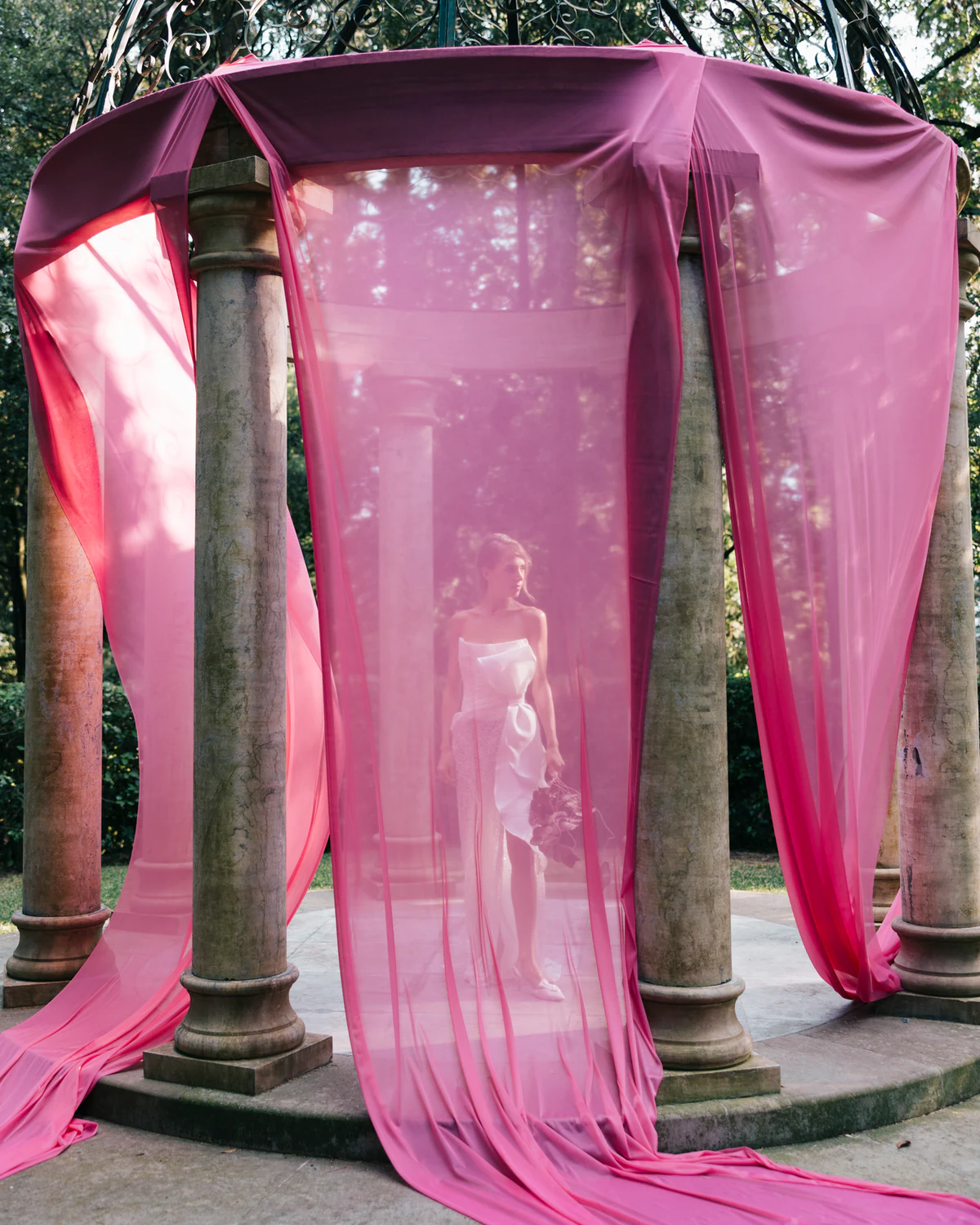 The pink gazebo between stone columns