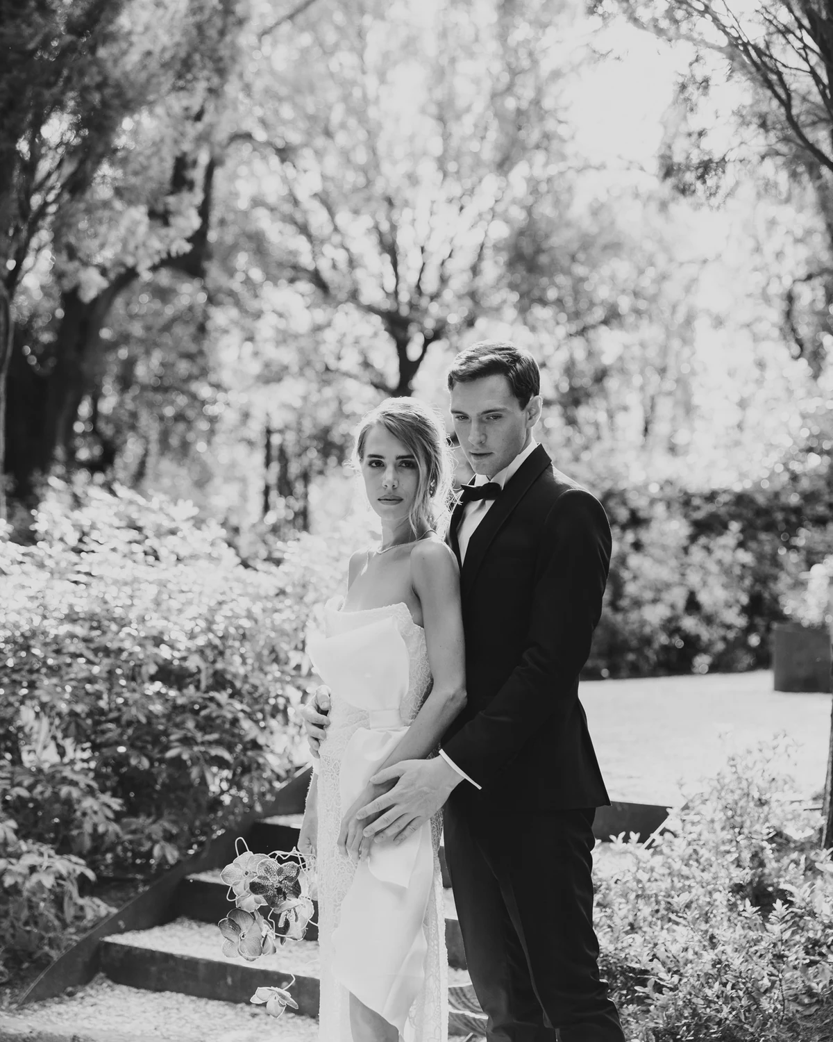 The couple in the garden under the trees