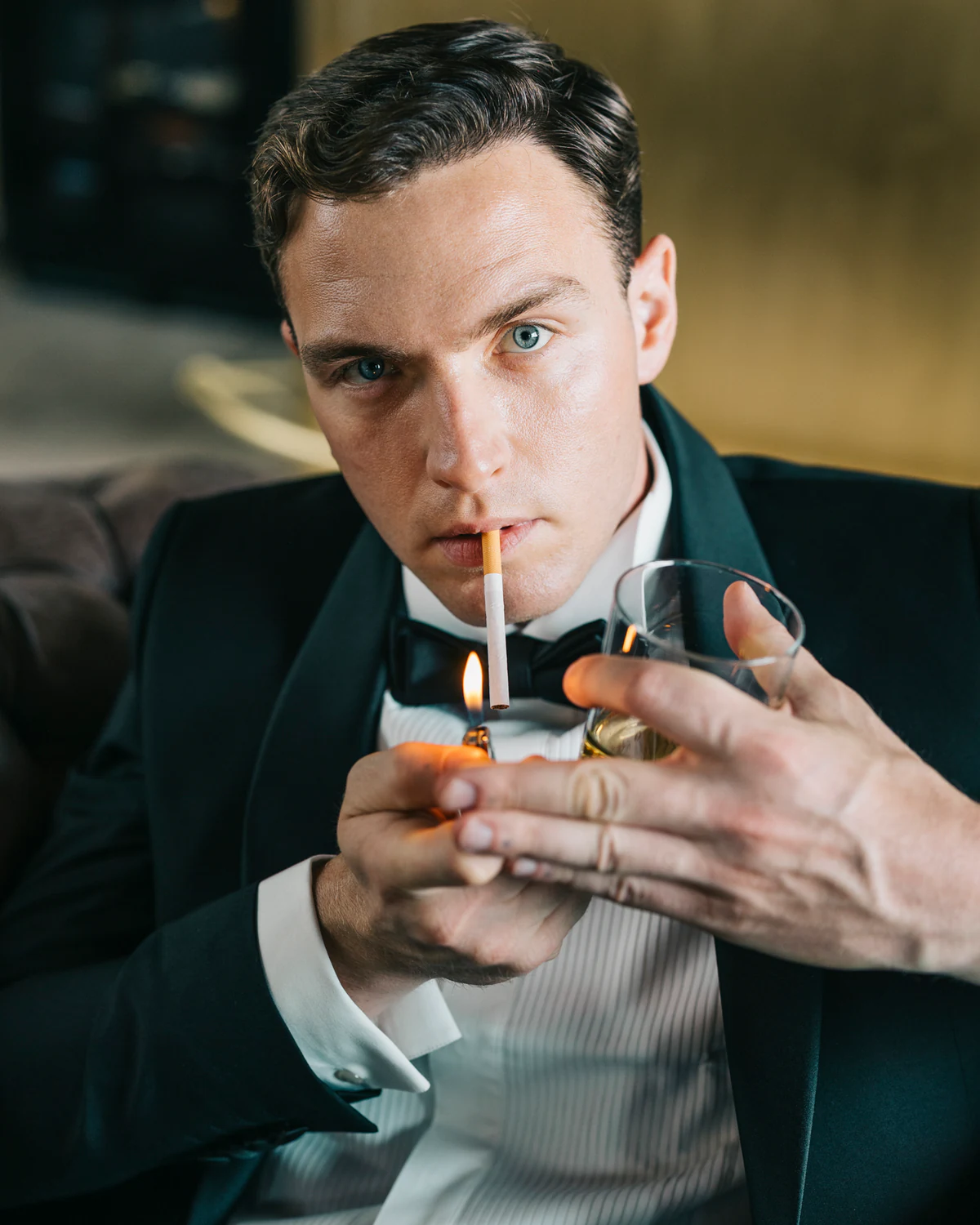 The groom lighting a cigarette
