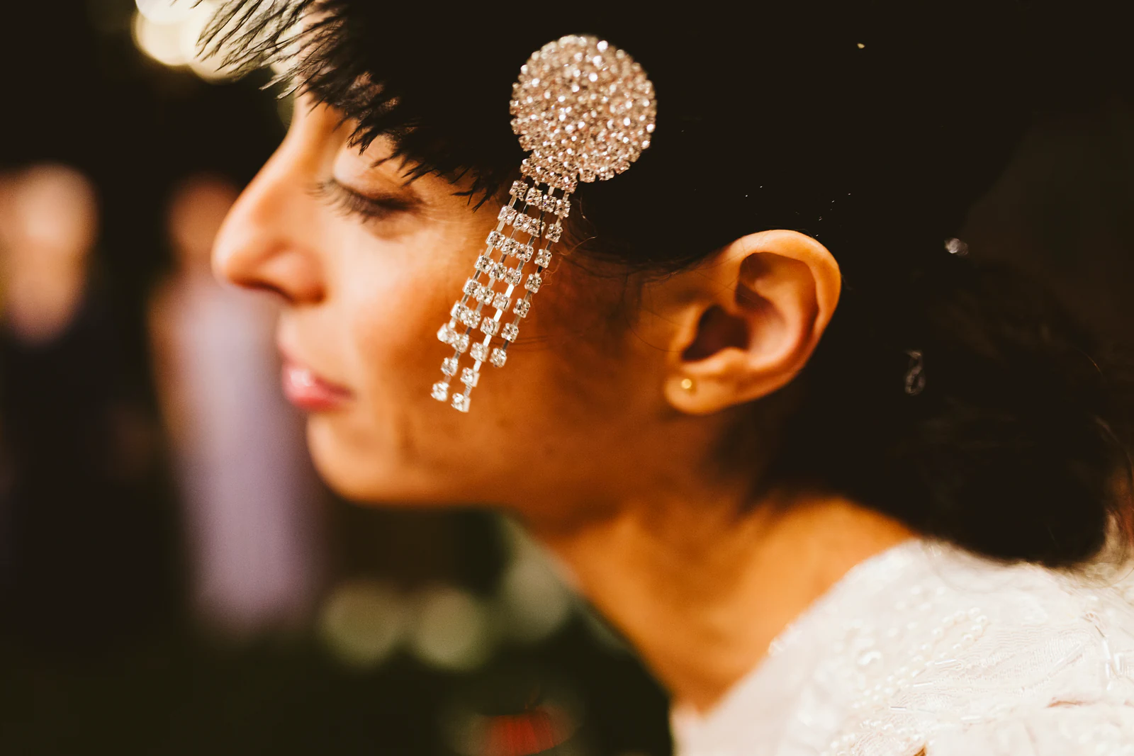 A guest with a crystal ornament in her hair
