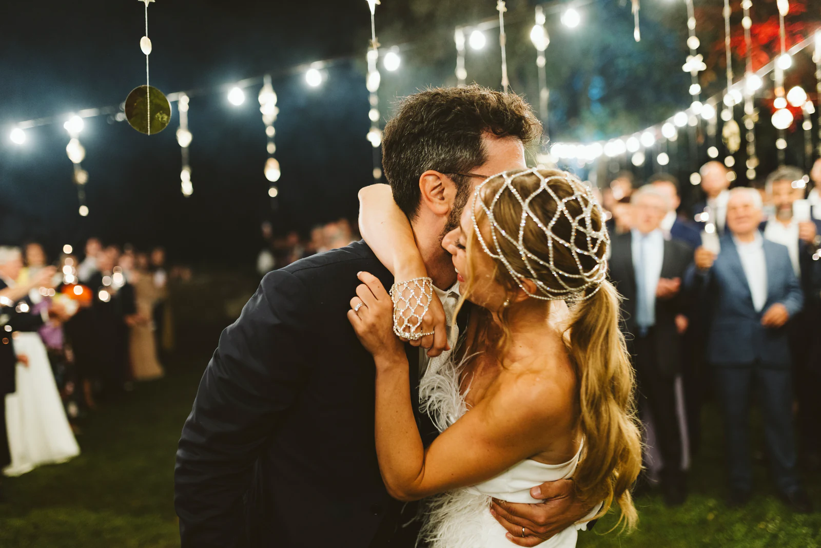 The groom kissing the bride on the dance floor