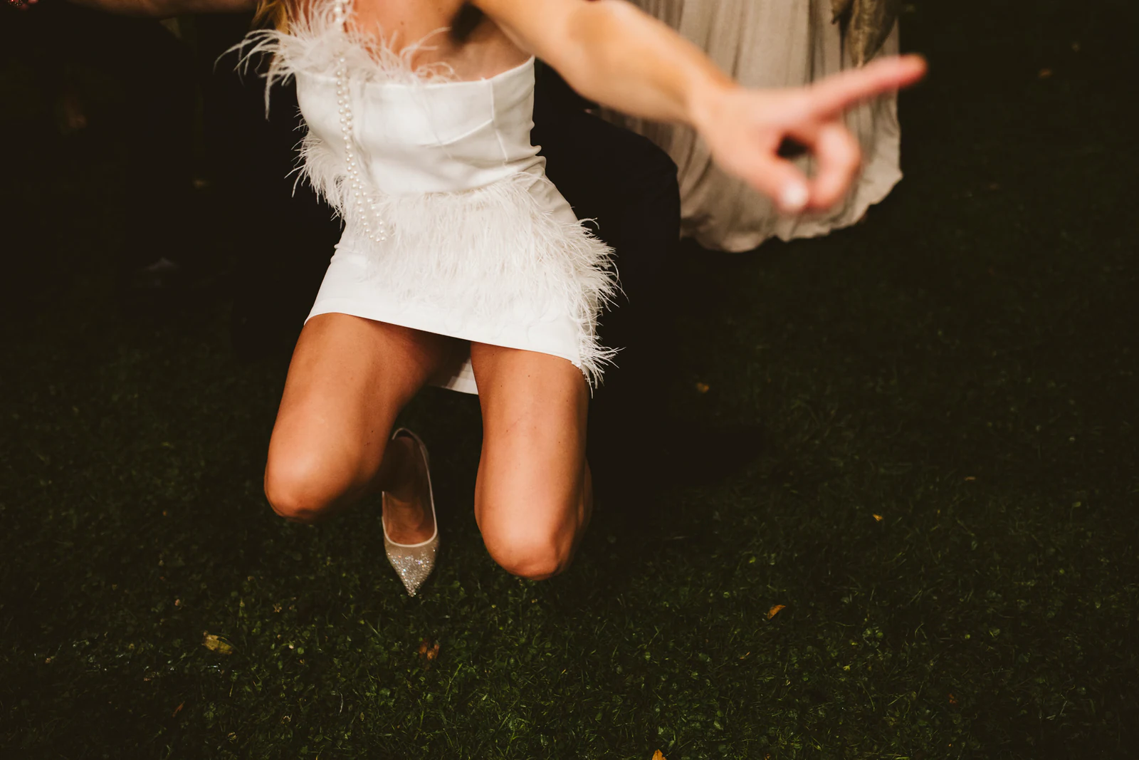 The bride dancing on the grass, close up